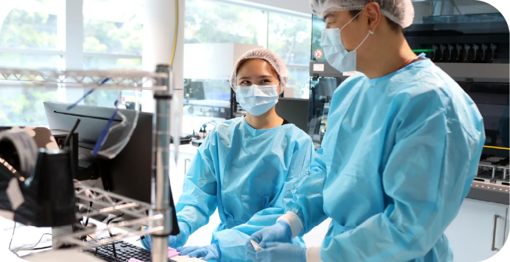 two scientists in a lab conducting vaginal microbiome testing